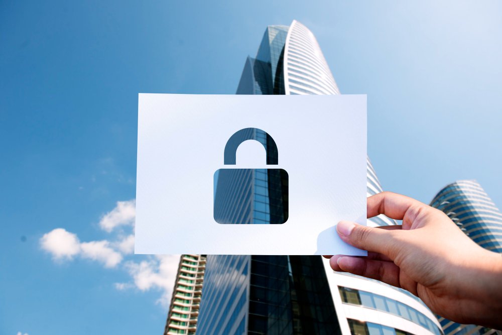 A keylock and a building in background that illustrate unlocking business to ASEAN requires legal documents translation