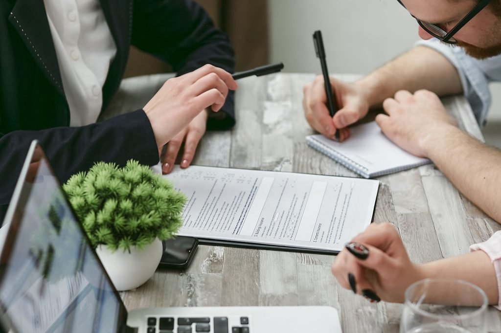  A professional team carefully reviewing documents to ensure accurate patent translation.