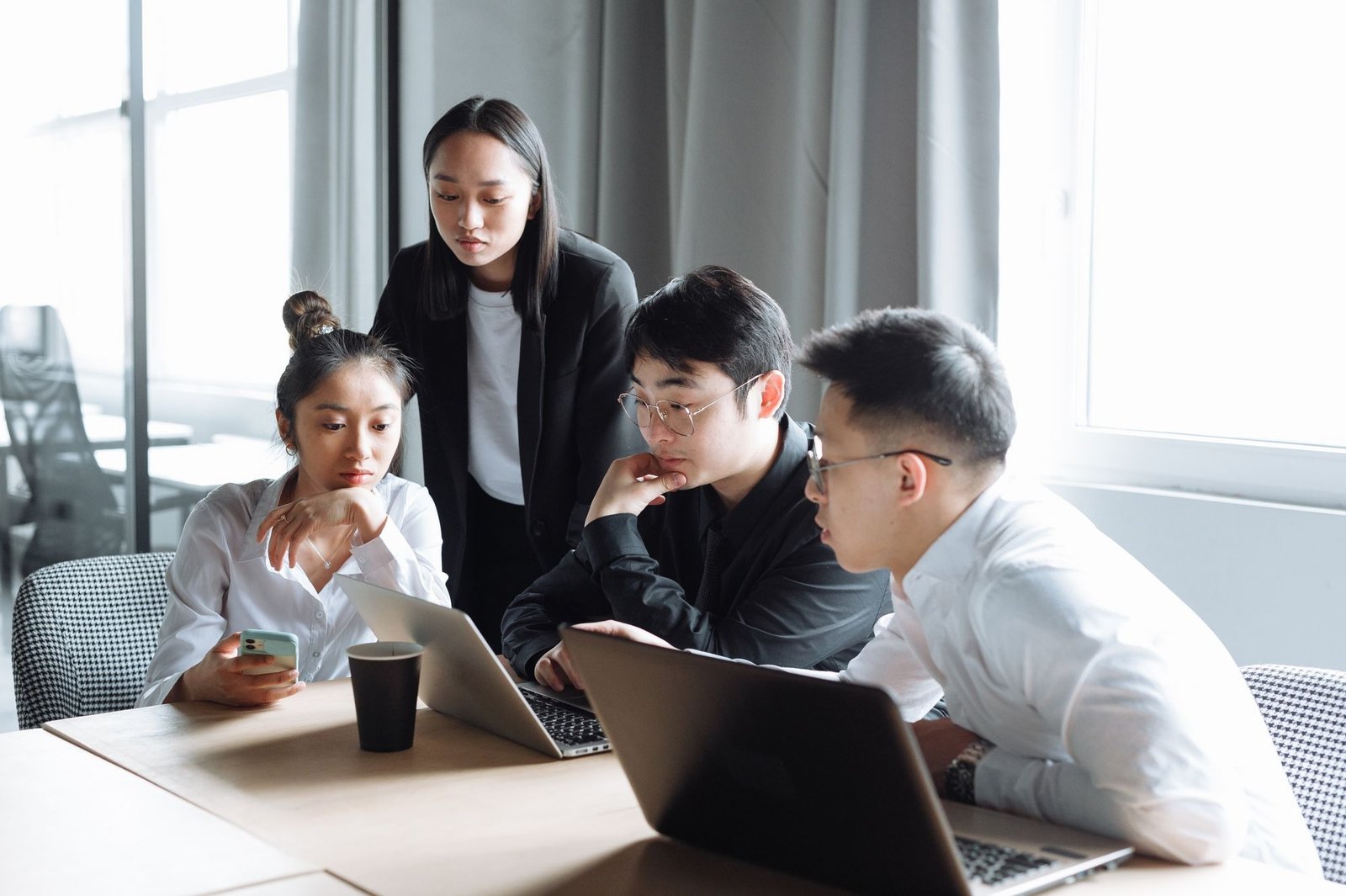 A team examines digital workflows to ensure continuous software and app localization for Southeast Asian markets.