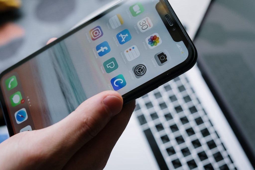 Mobile apps on a smartphone illustrate the importance of localization for Southeast Asia.
