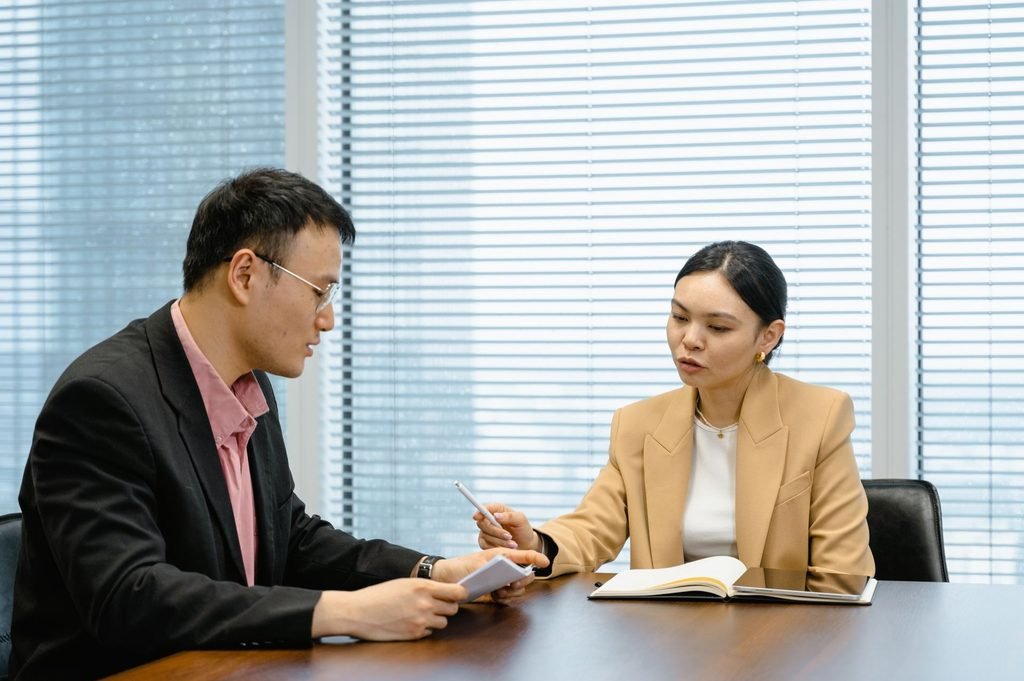A team reviews documents to identify jurisdiction-specific legal terms and requirements.
