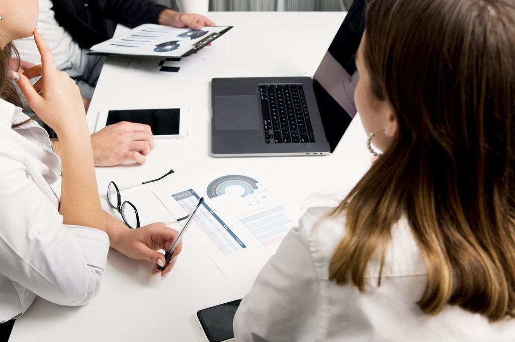 Team members evaluate documents and data to find inconsistencies and improve accuracy.